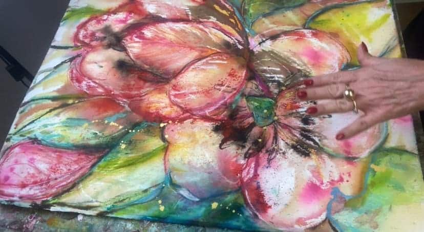 a painting of flowers on a surface